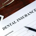 Dental insurance form on a polished desk, ready for completion.